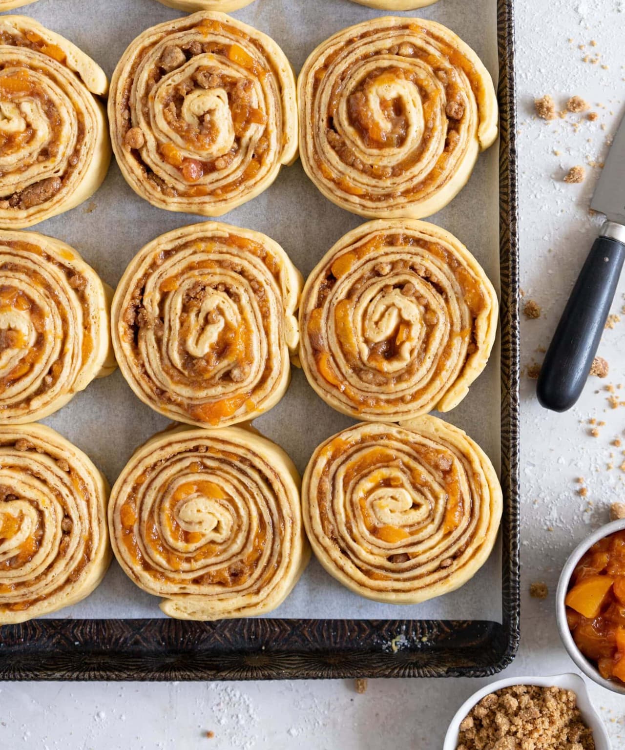 Laminated Brioche Cinnamon Buns with Peach Compote and Brown Butter