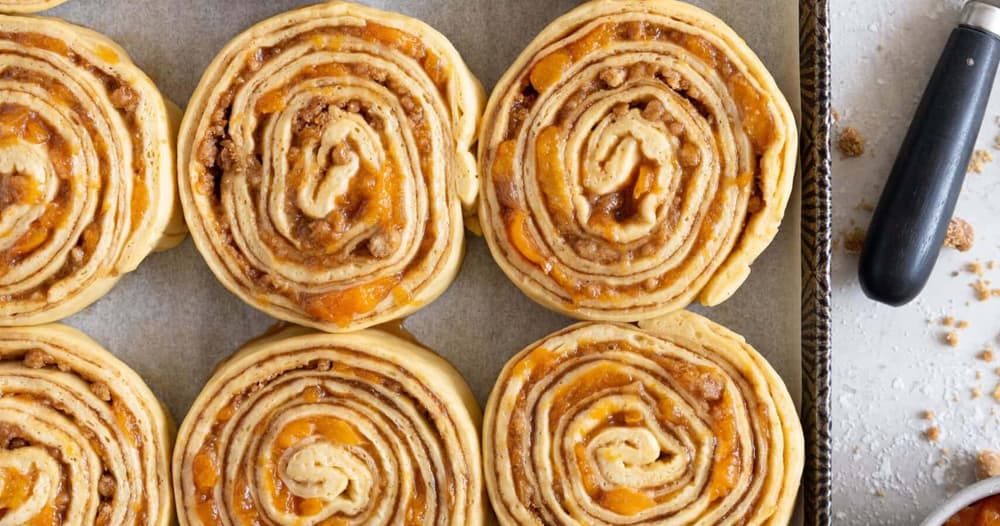 Laminated Brioche Cinnamon Buns with Peach Compote and Brown Butter