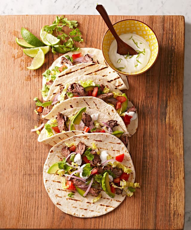 Skirt Steak Tacos with Guacamole and Lime Crema Punchfork