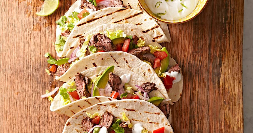 Skirt Steak Tacos with Guacamole and Lime Crema Punchfork
