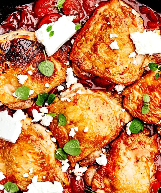 Chicken Thighs with Burst Tomatoes, Harissa, and Feta Punchfork