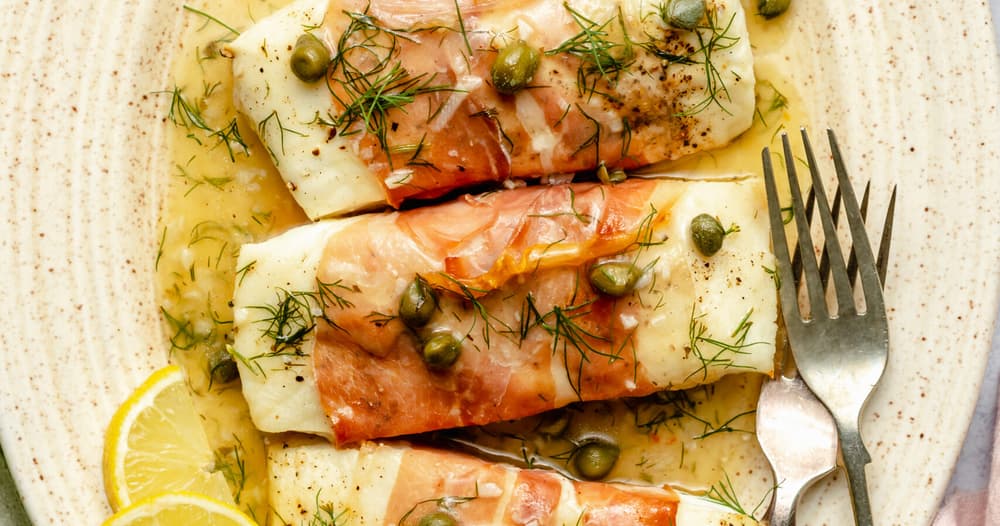 Prosciutto Wrapped Halibut with LemonDill Caper Sauce Punchfork
