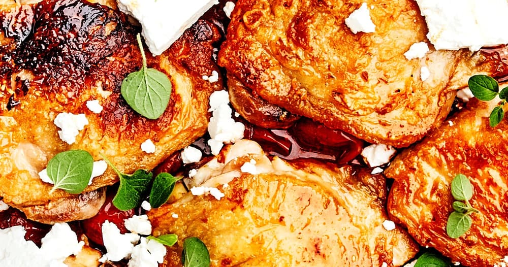 Chicken Thighs with Burst Tomatoes, Harissa, and Feta Punchfork