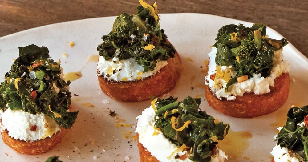 Broiled Goat Cheese Toasts with Marinated Greens Punchfork