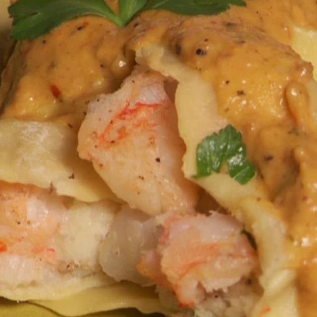 Shrimp and Salt Cod Ravioli with Yellow Pepper Romesco Sauce Punchfork
