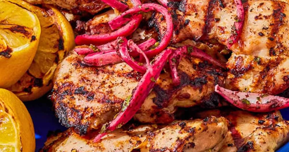 Grilled Chicken Thighs with Sumac, Pickled Onions, and Charred Lemon
