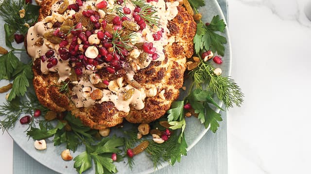 Whole Roasted Cauliflower with Pomegranate Tahini Sauce, Raisins ...